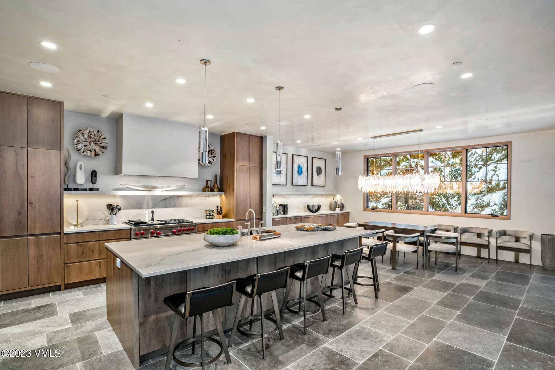 1033 Homestake Circle Vail, CO 81657 - Photo 6 of 30 a kitchen with lots of counter top space and dining table