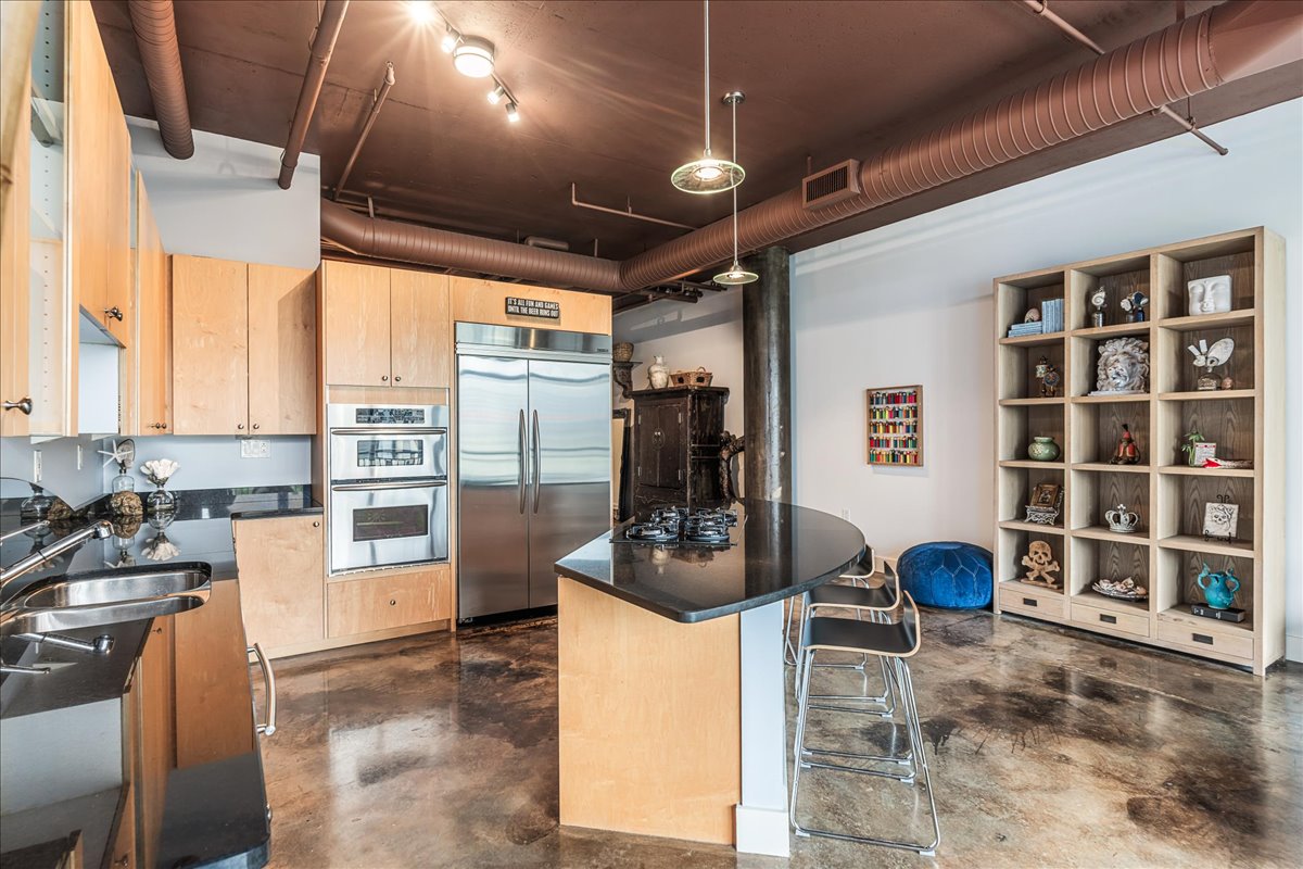 311 West 5th Street, Unit 703 Austin, TX 78701 - Photo 11 of 30 a room with furniture a window and gym equipment