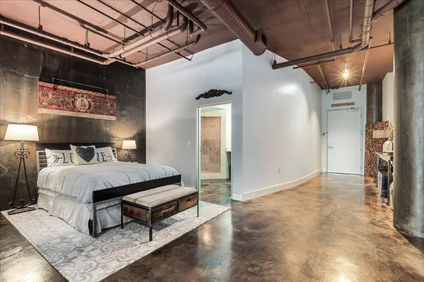 a bedroom with a bed and a walk in closet