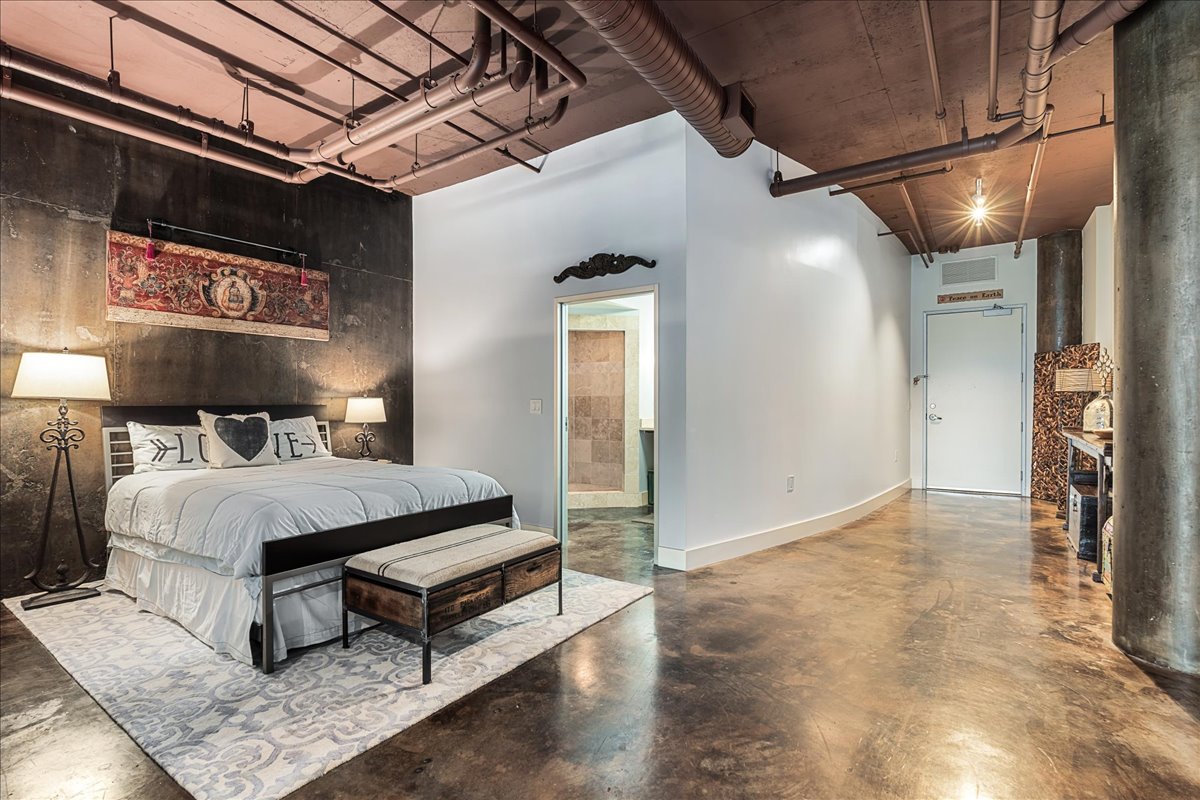 311 West 5th Street, Unit 703 Austin, TX 78701 - Photo 16 of 30 a bedroom with a bed and a walk in closet