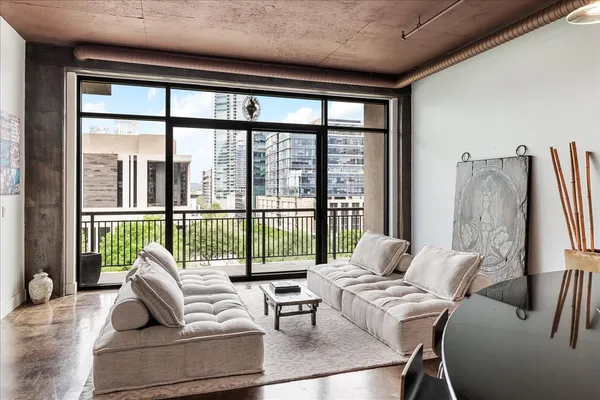 a living room with furniture and a large window