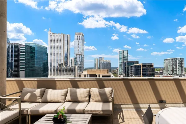 a view of a balcony with city view