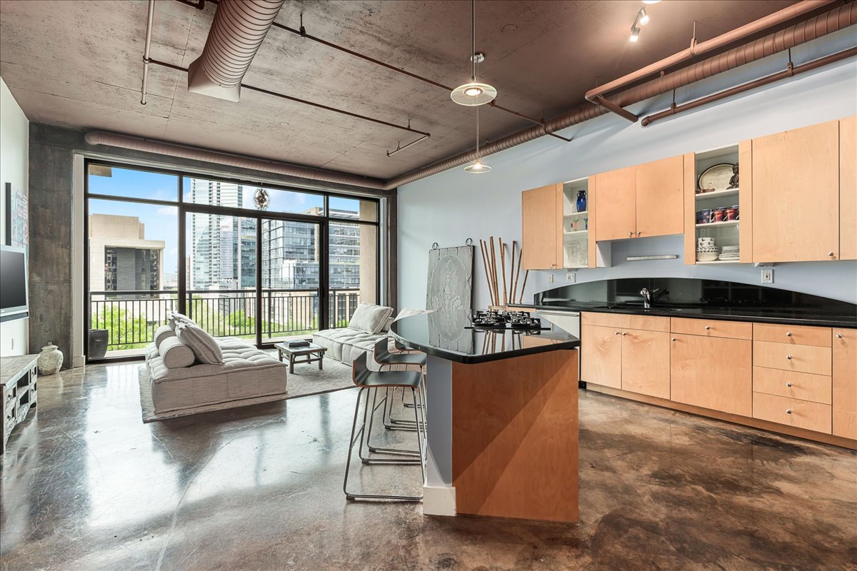 311 West 5th Street, Unit 703 Austin, TX 78701 - Photo 6 of 30 a living room with furniture and a large window
