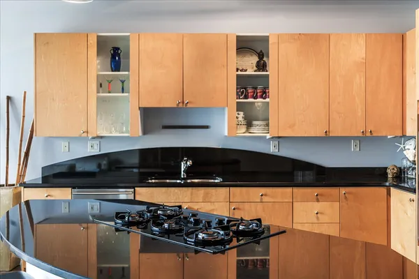a kitchen with a sink and a stove