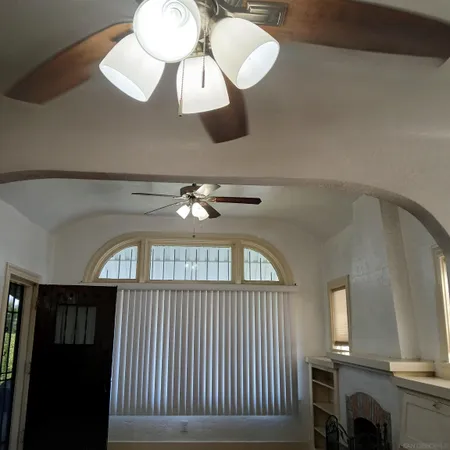 a view of a livingroom with furniture and chandelier