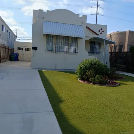 a front view of a house with garden