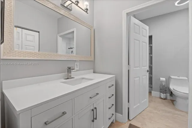 a bathroom with a shower and a toilet