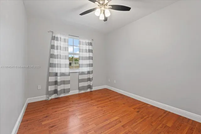 a view of a hallway with washer and dryer