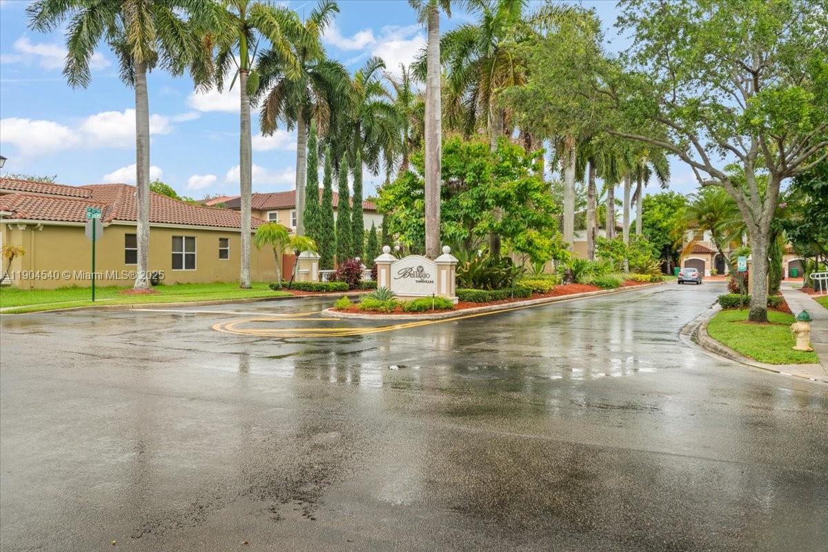 12720 Southwest 49th Court Miramar, FL 33027 - Photo 25 of 26 a view of a swimming pool with a garden