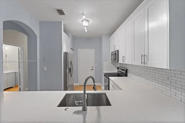 a view of an empty room with a window