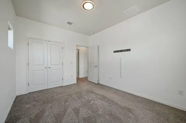 a bathroom with a double vanity sink toilet mirror and shower