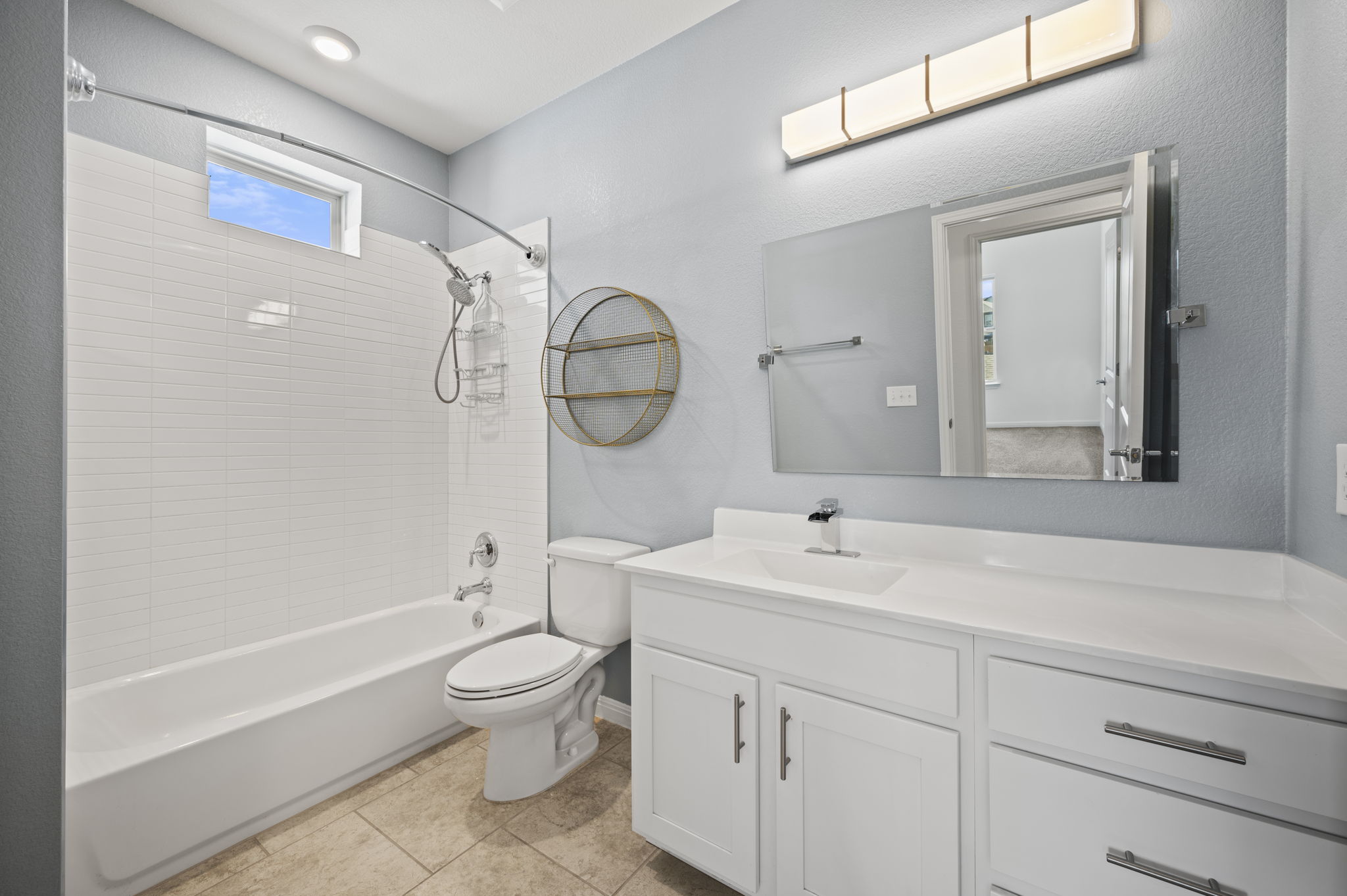 5809 Charles Merle Dr., Unit B Austin, TX 78747 - Photo 16 of 27 Bathroom featuring vanity, shower / bathing tub combination, toilet, and tile patterned floors