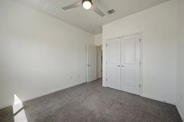 a view of an empty walk in closet