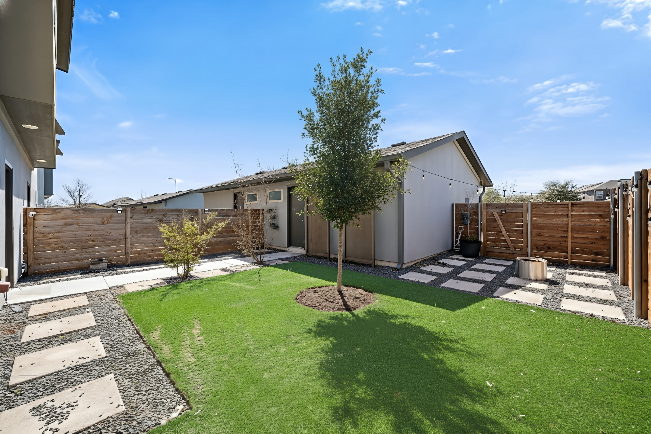 5809 Charles Merle Dr., Unit B Austin, TX 78747 - Photo 20 of 27 Fenced backyard featuring a patio