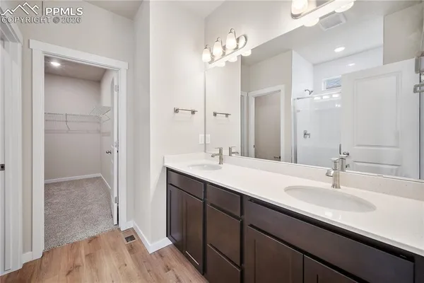 a bathroom with a glass shower door