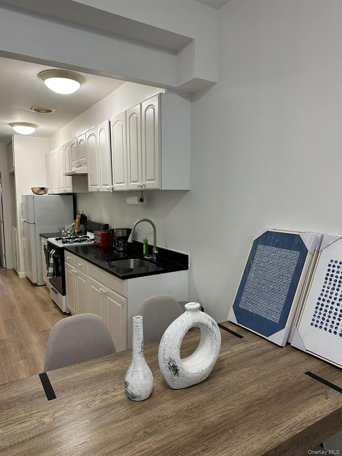 1435 2nd Avenue Manhattan, NY 10021 - Photo 24 of 33 a kitchen with a sink and a cabinets