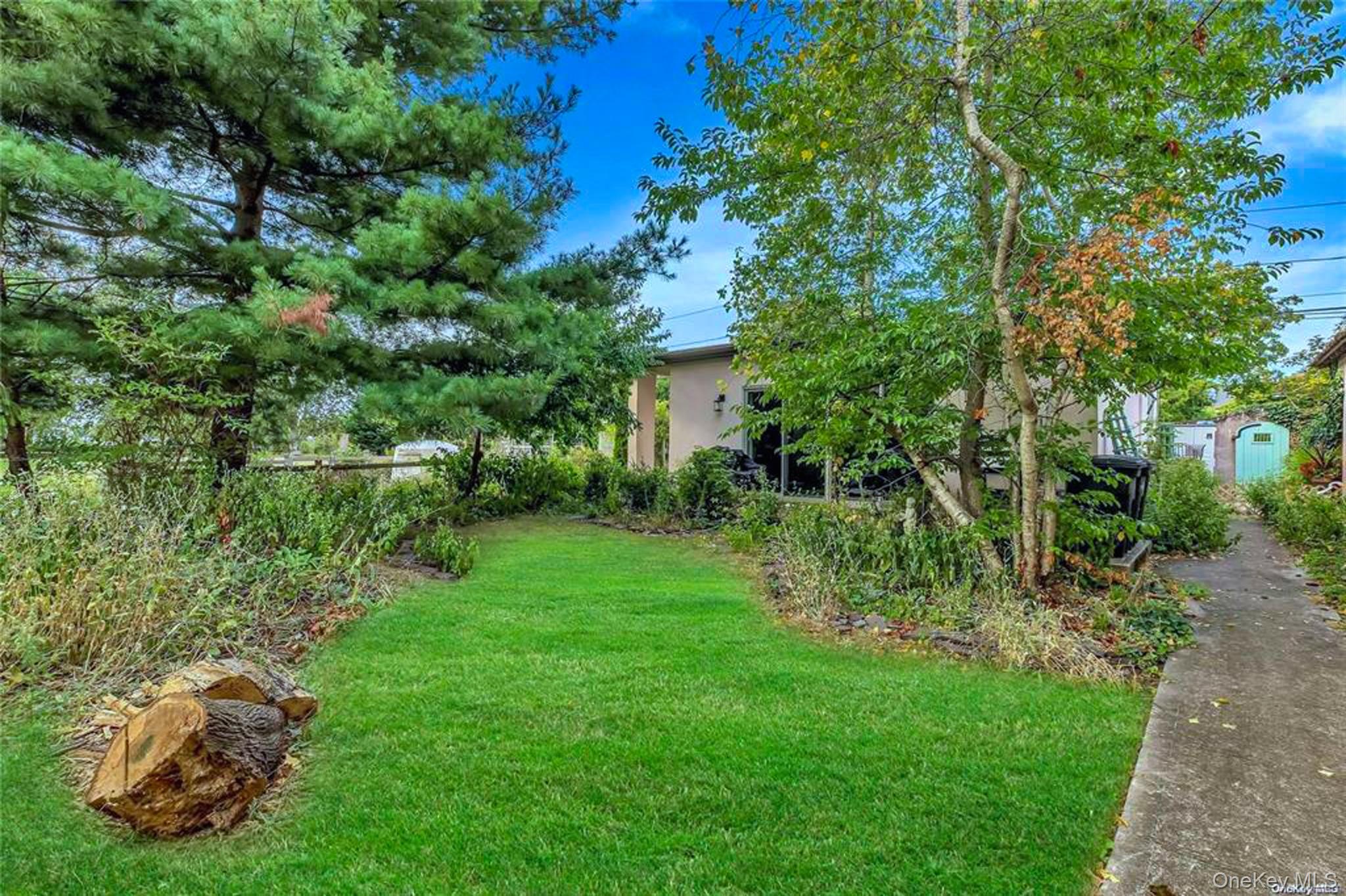 34 Maple Street Islip, NY 11751 - Photo 3 of 10 View of grassy yard