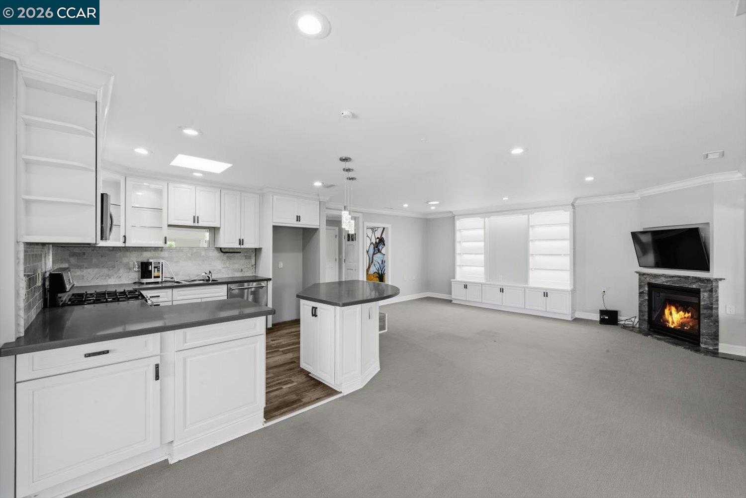 2741 Golden Rain Road, Unit 7 Walnut Creek, CA 94595 - Photo 15 of 60 a kitchen with stainless steel appliances kitchen island granite countertop a sink and white cabinets