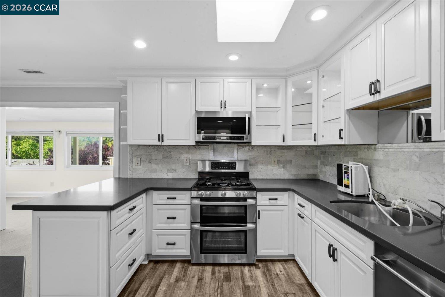 2741 Golden Rain Road, Unit 7 Walnut Creek, CA 94595 - Photo 17 of 60 a kitchen with granite countertop a stove and a sink