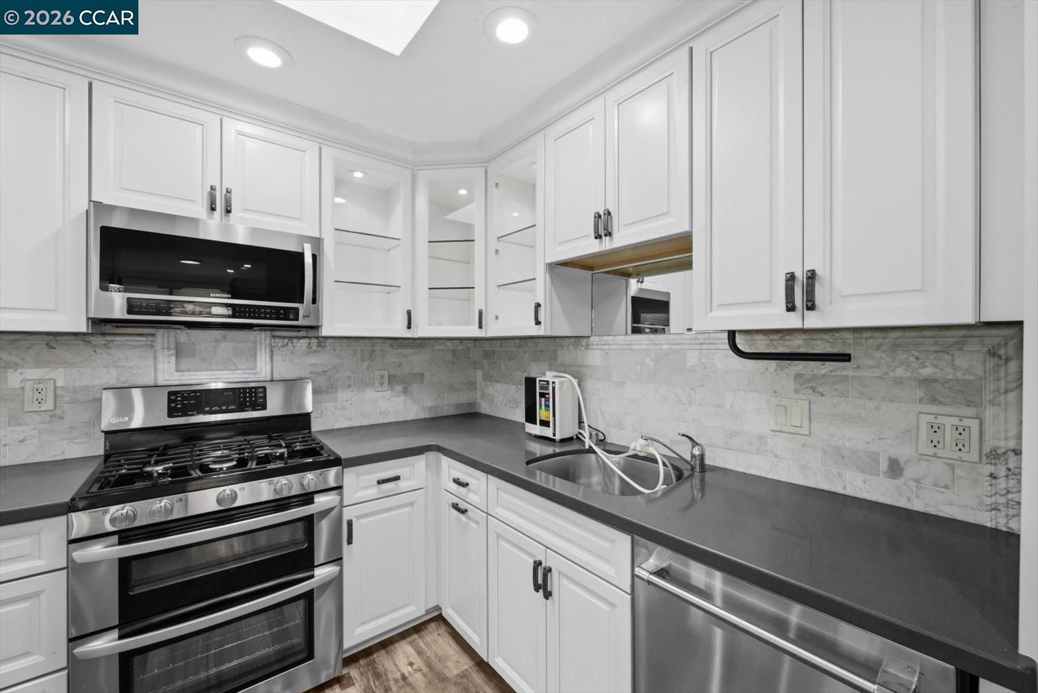 2741 Golden Rain Road, Unit 7 Walnut Creek, CA 94595 - Photo 18 of 60 a kitchen with stainless steel appliances granite countertop a sink a stove and cabinets