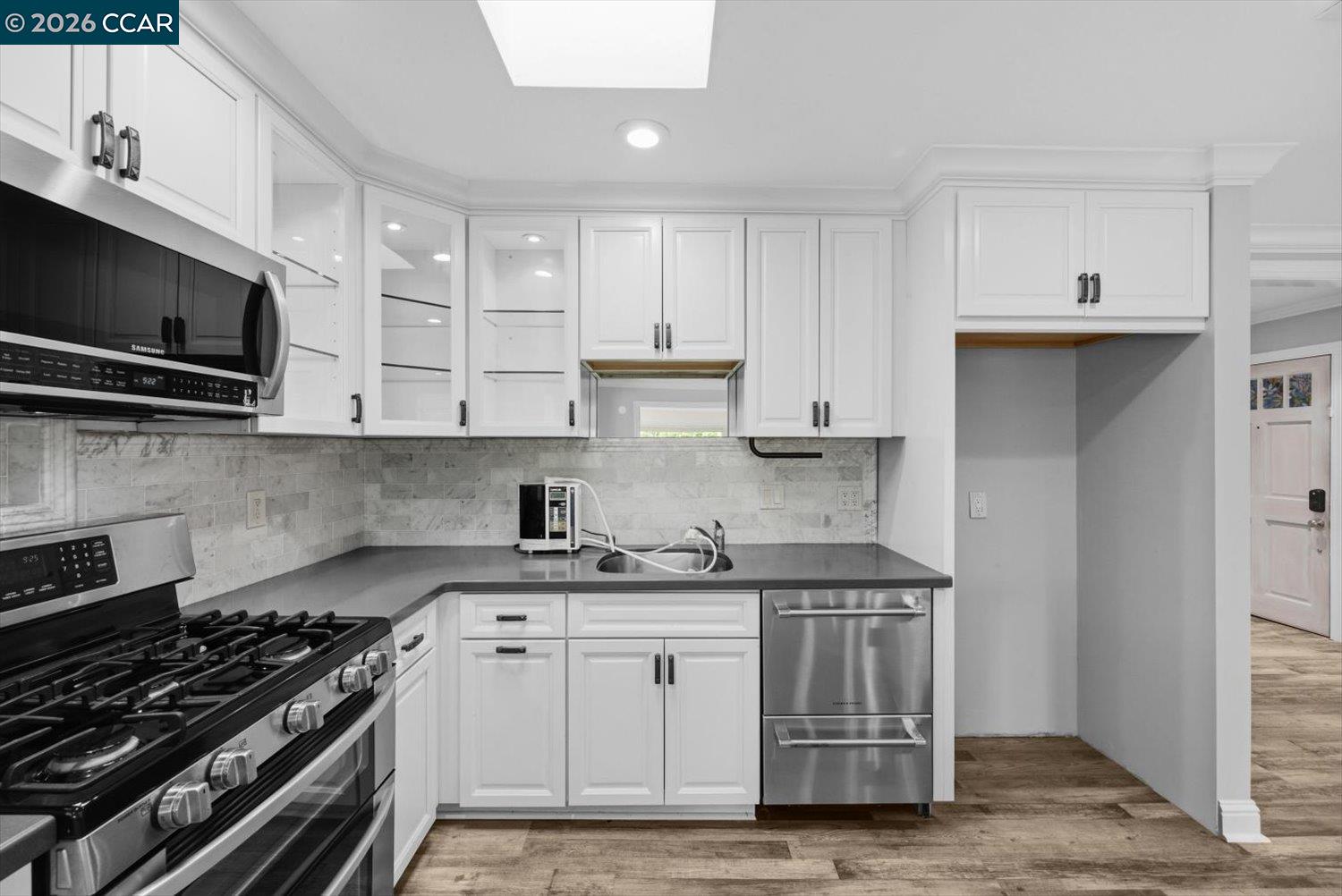 2741 Golden Rain Road, Unit 7 Walnut Creek, CA 94595 - Photo 19 of 60 a kitchen with stainless steel appliances granite countertop a stove and a microwave