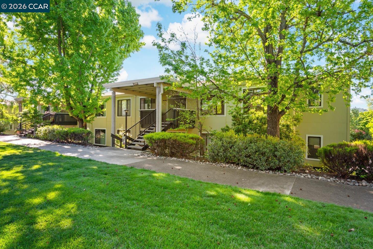2741 Golden Rain Road, Unit 7 Walnut Creek, CA 94595 - Photo 2 of 60 a view of a patio with couches plants and large tree