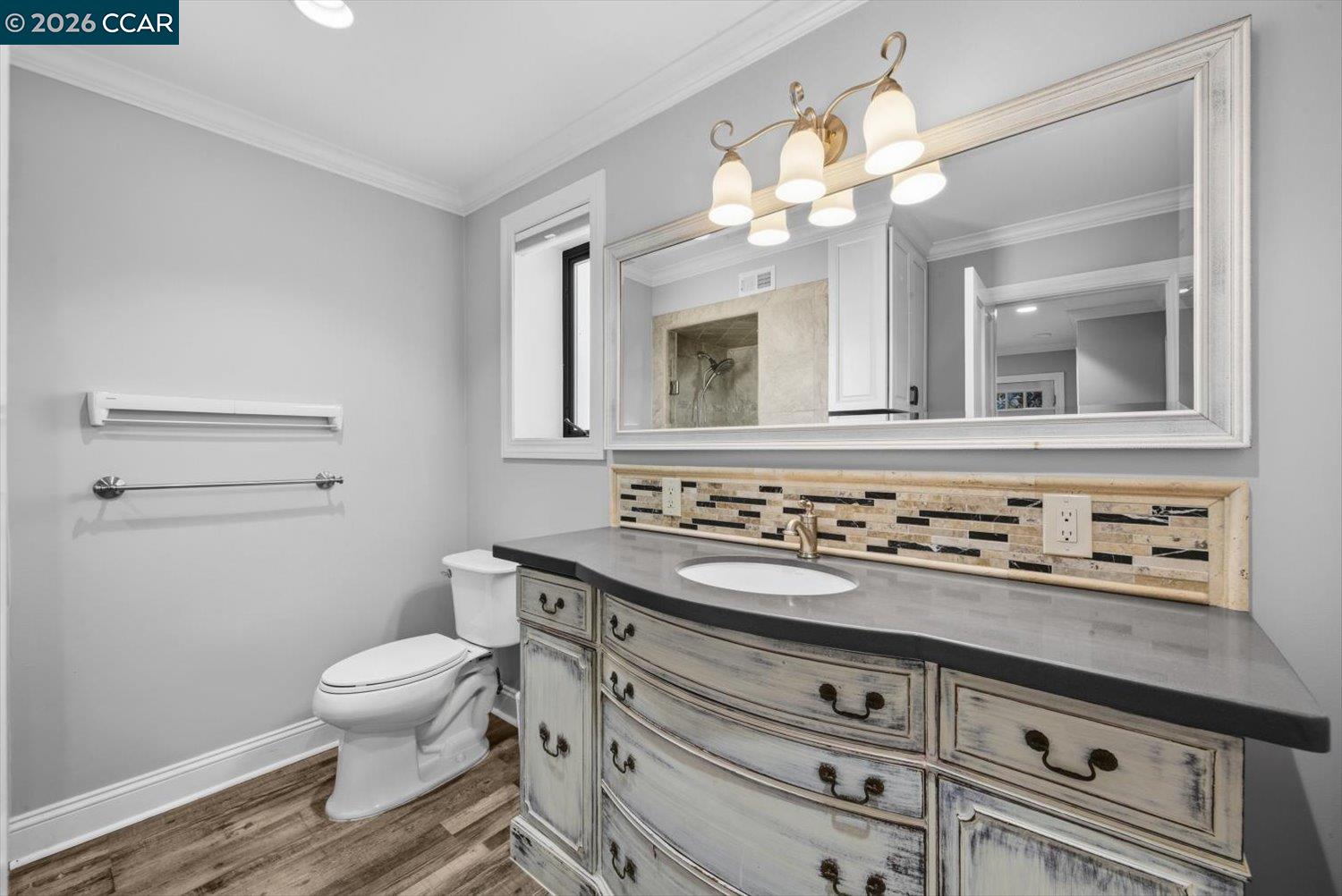 2741 Golden Rain Road, Unit 7 Walnut Creek, CA 94595 - Photo 32 of 60 a bathroom with a sink a toilet and a mirror