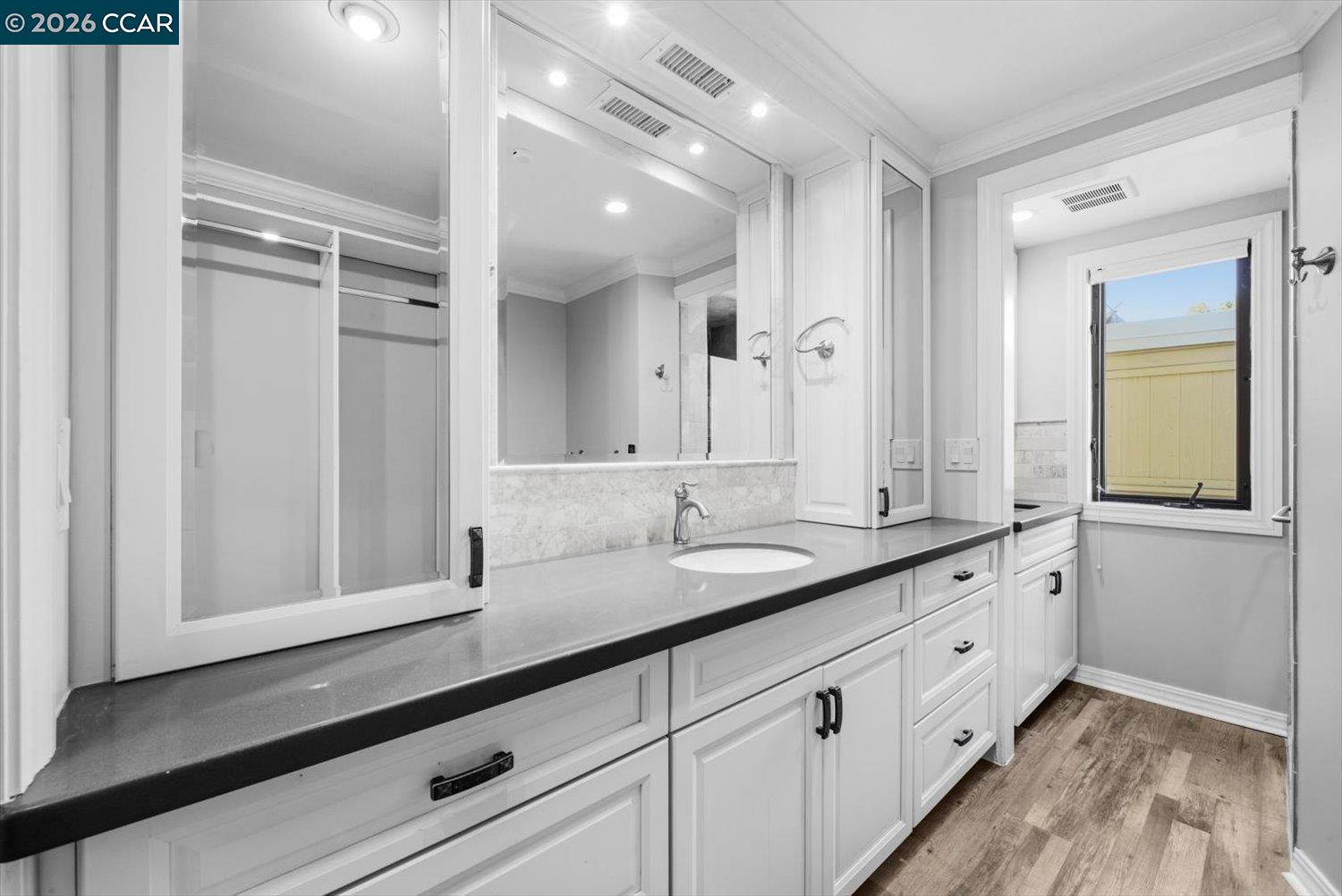 2741 Golden Rain Road, Unit 7 Walnut Creek, CA 94595 - Photo 40 of 60 a bathroom with double sink and a mirror