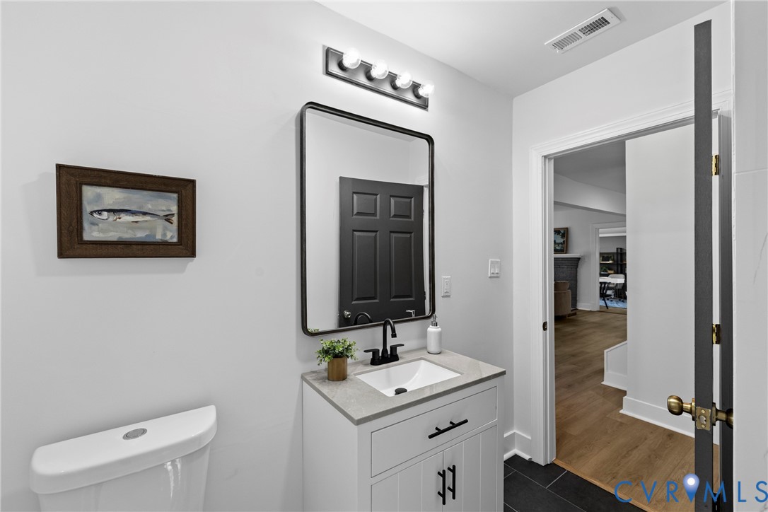 821 Fort Lee Road Petersburg, VA 23803 - Photo 21 of 45 White vanity with a stone countertop, an integrate