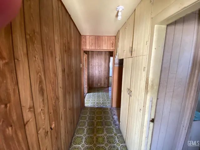 a white toilet sitting next to a bathroom sink and a shower
