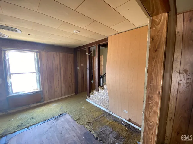 a bathroom with a granite countertop shower a sink and a mirror