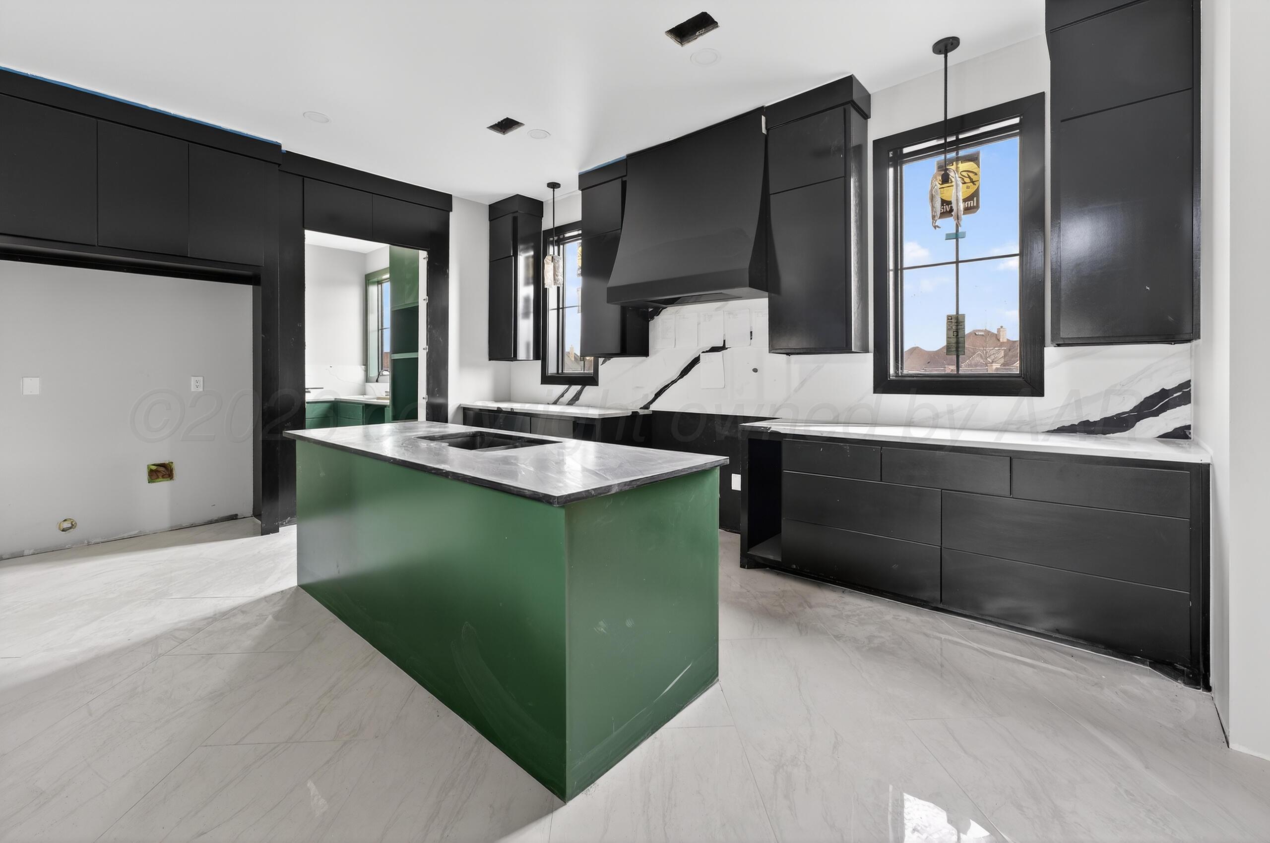 5602 Boyce Court Amarillo, TX 79119 - Photo 16 of 17 a kitchen with a sink cabinets and window