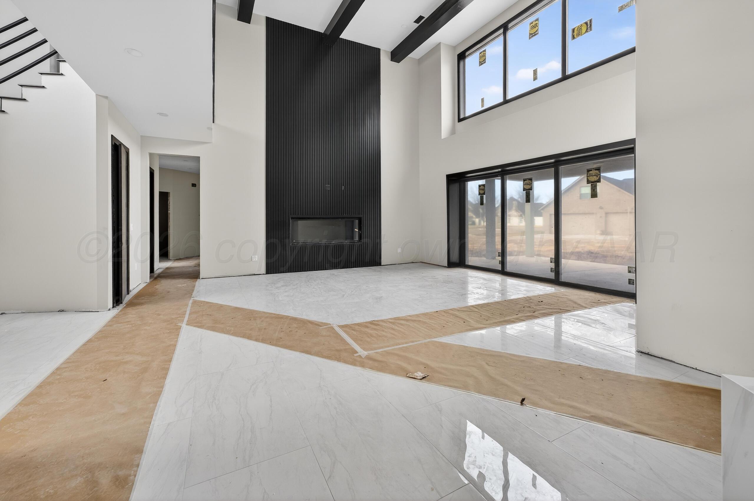 5602 Boyce Court Amarillo, TX 79119 - Photo 7 of 17 a bedroom with a bed and large window