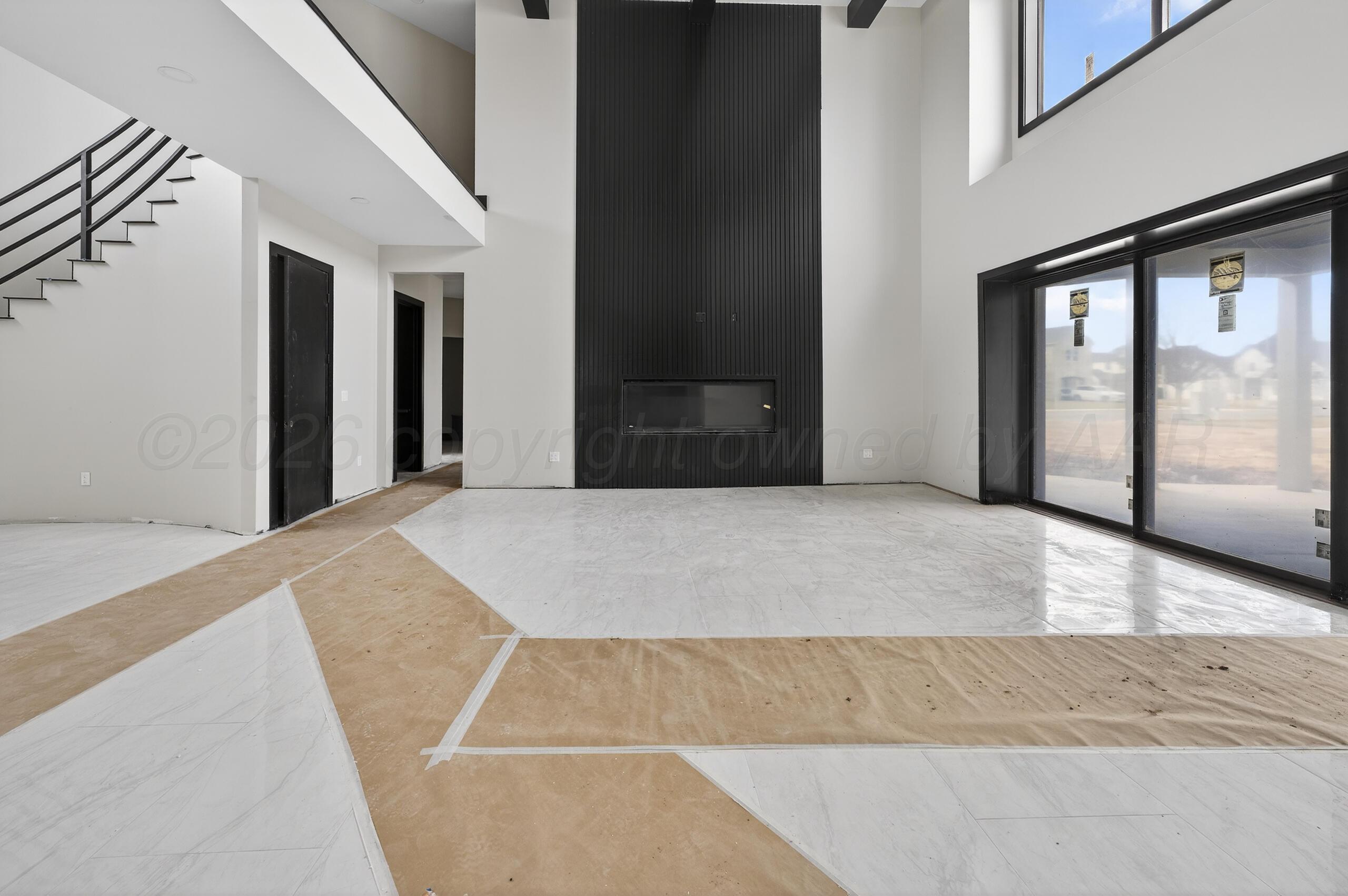 5602 Boyce Court Amarillo, TX 79119 - Photo 8 of 17 a bedroom with a bed and large window