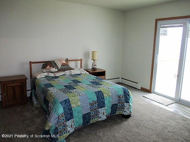 700 Stock Farm Road Lake Ariel, PA 18436 - Photo 13 of 37 a bedroom with a bed and a window