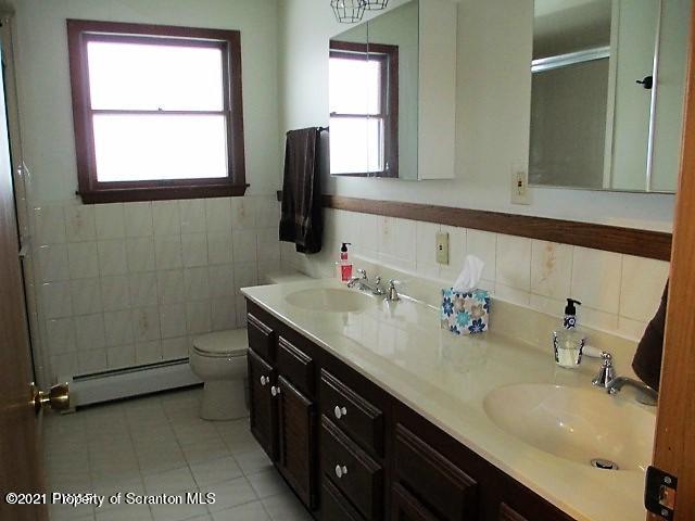 700 Stock Farm Road Lake Ariel, PA 18436 - Photo 18 of 37 a bathroom with a sink double vanity and a mirror