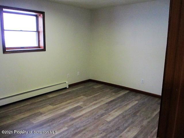 700 Stock Farm Road Lake Ariel, PA 18436 - Photo 24 of 37 a view of an empty room with wooden floor and a window