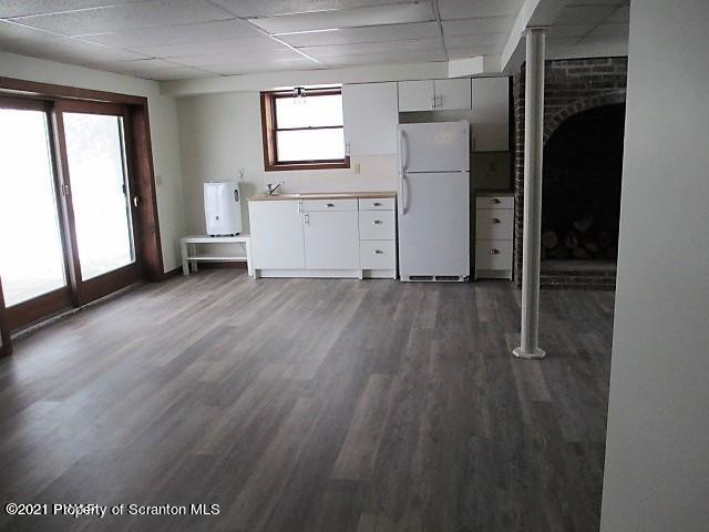 700 Stock Farm Road Lake Ariel, PA 18436 - Photo 27 of 37 an empty room with wooden floor and windows