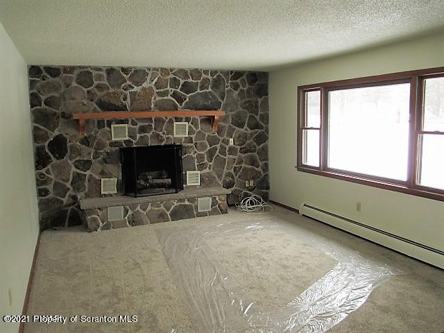 700 Stock Farm Road Lake Ariel, PA 18436 - Photo 9 of 37 a living room with furniture and a fireplace