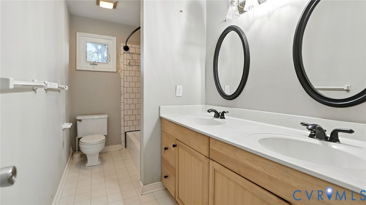 2425 Boissevain Road Henrico, VA 23229 - Photo 29 of 37 Bathroom featuring double vanity, shower / bath co