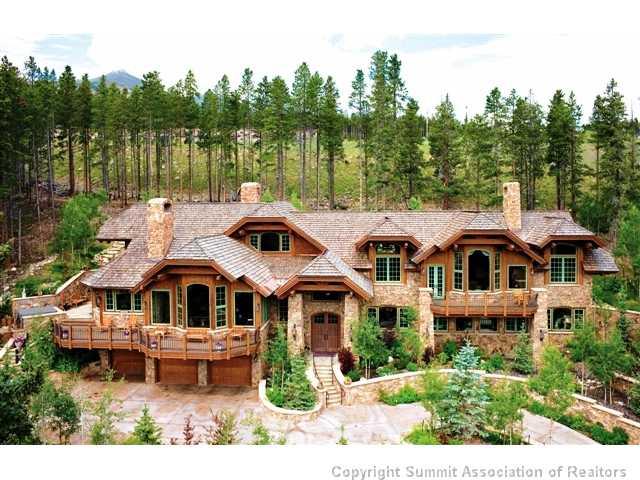 1060 4 O Clock Road Breckenridge, CO 80424 - Photo 11 of 12 a front view of a house with a garden and lake view