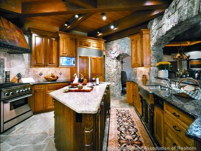 1060 4 O Clock Road Breckenridge, CO 80424 - Photo 5 of 12 a kitchen with sink stove and cabinets