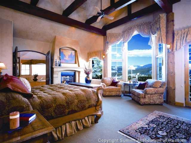 1060 4 O Clock Road Breckenridge, CO 80424 - Photo 8 of 12 a bedroom with furniture and a large window