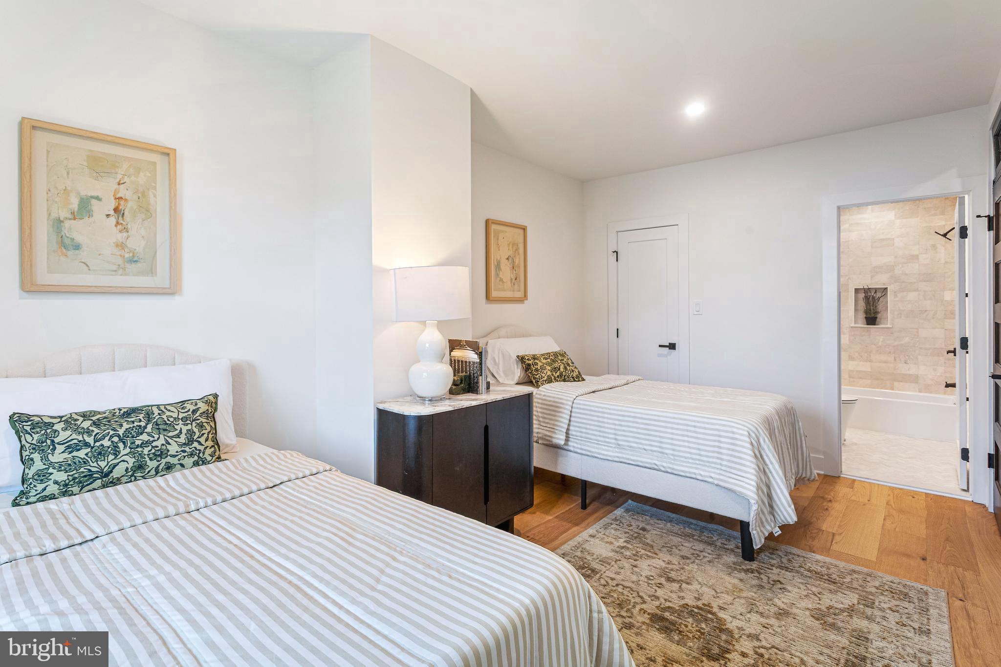 1213 Kennedy Street Northwest Washington, DC 20011 - Photo 25 of 43 a bedroom with a bed and a painting on the wall