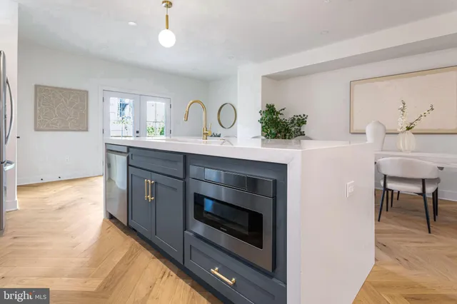 a kitchen with a stove and a sink