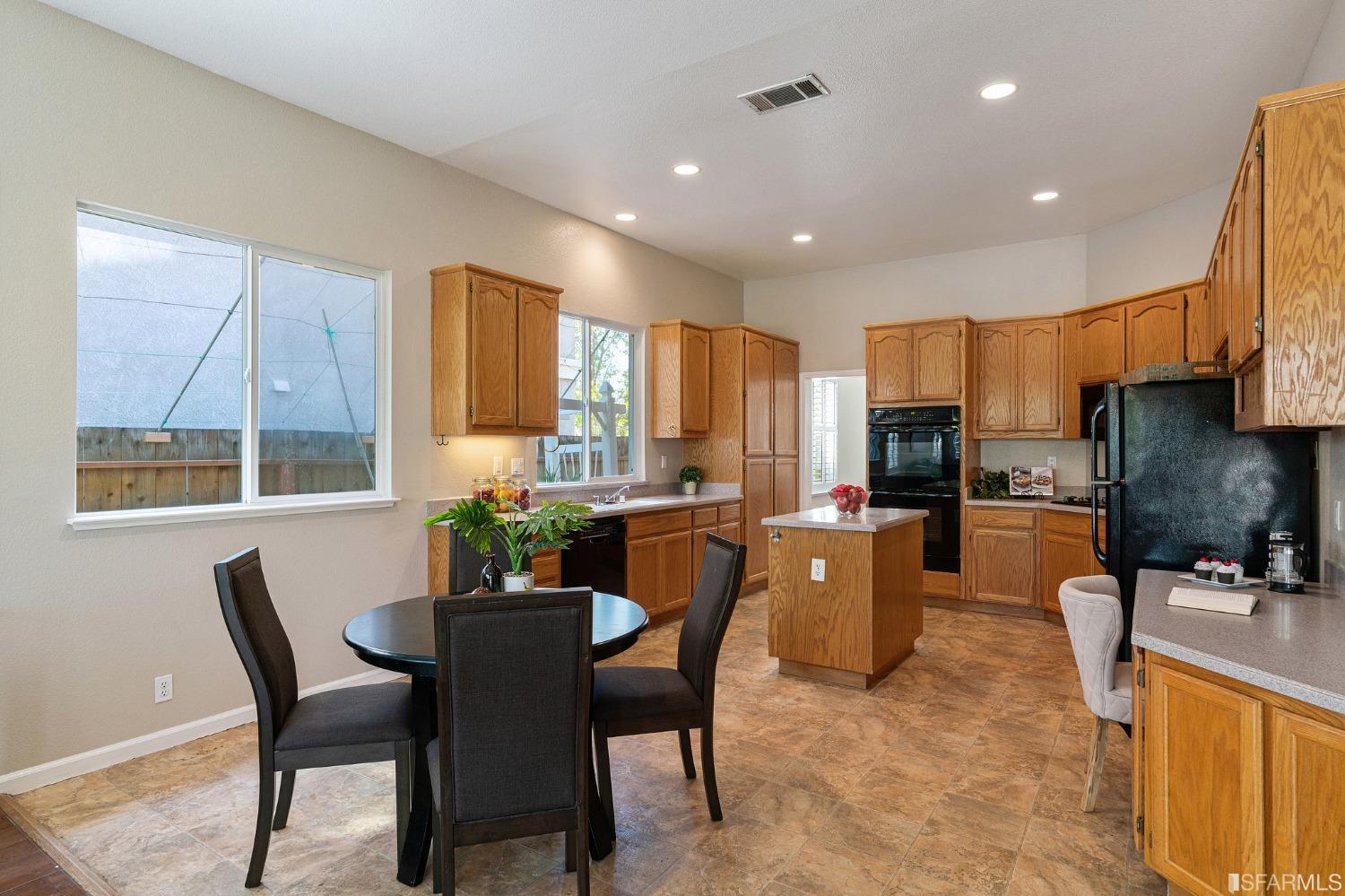 1359 Oak Crest Way Antioch, CA 94531 - Photo 18 of 65 a view of a dining room with furniture window and outside view