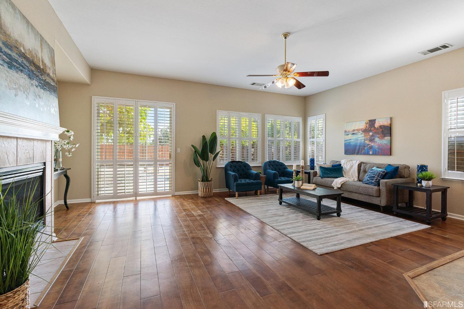1359 Oak Crest Way Antioch, CA 94531 - Photo 23 of 65 a living room with furniture a fireplace and a table