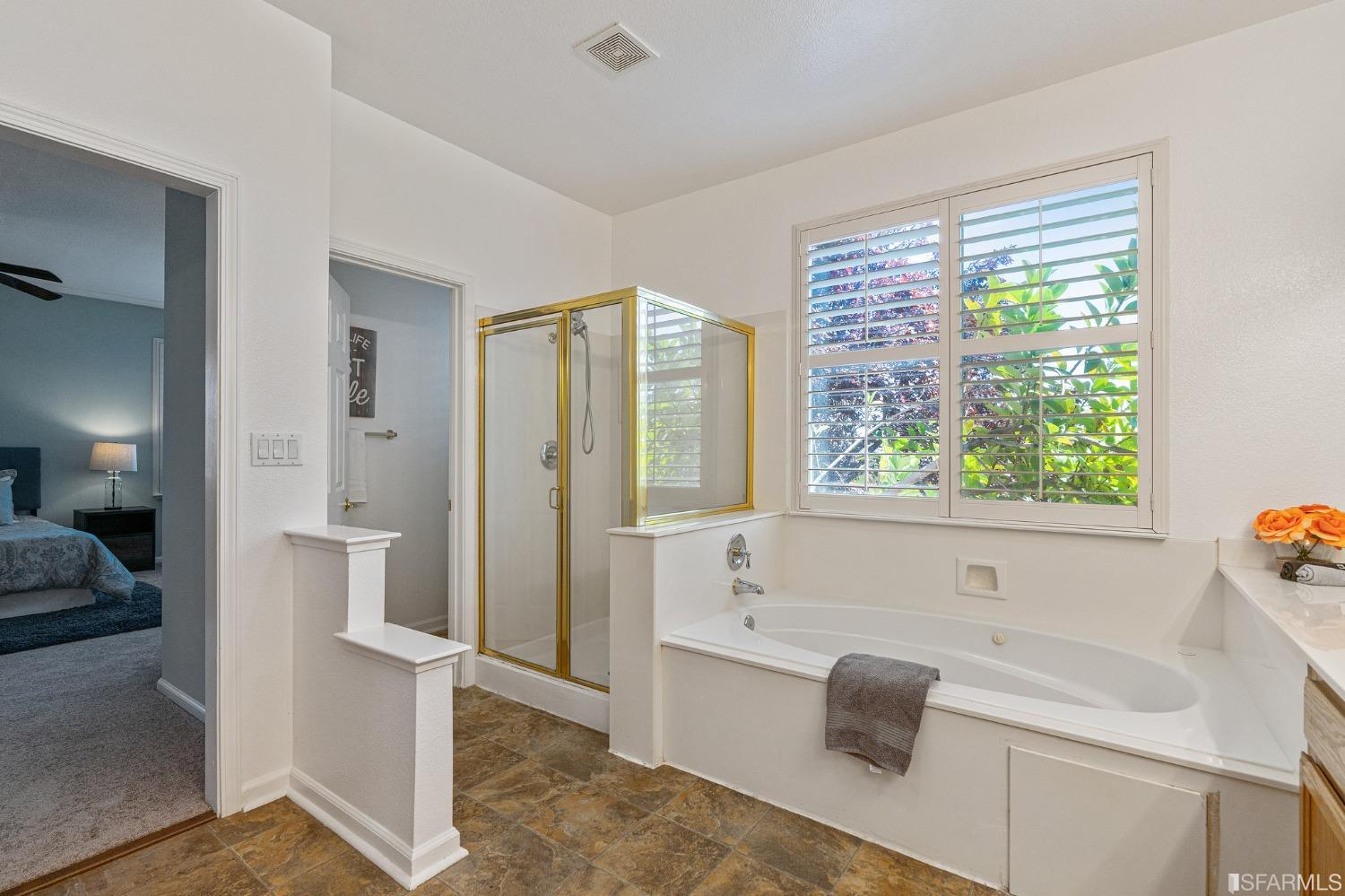 1359 Oak Crest Way Antioch, CA 94531 - Photo 46 of 65 a bathroom with a tub sink and mirror
