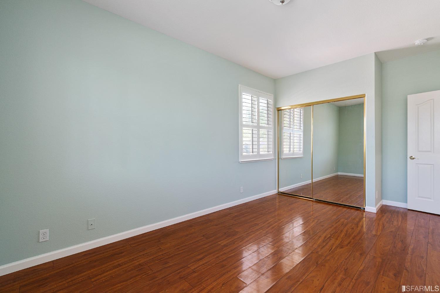 1359 Oak Crest Way Antioch, CA 94531 - Photo 50 of 65 an empty room with wooden floor and windows