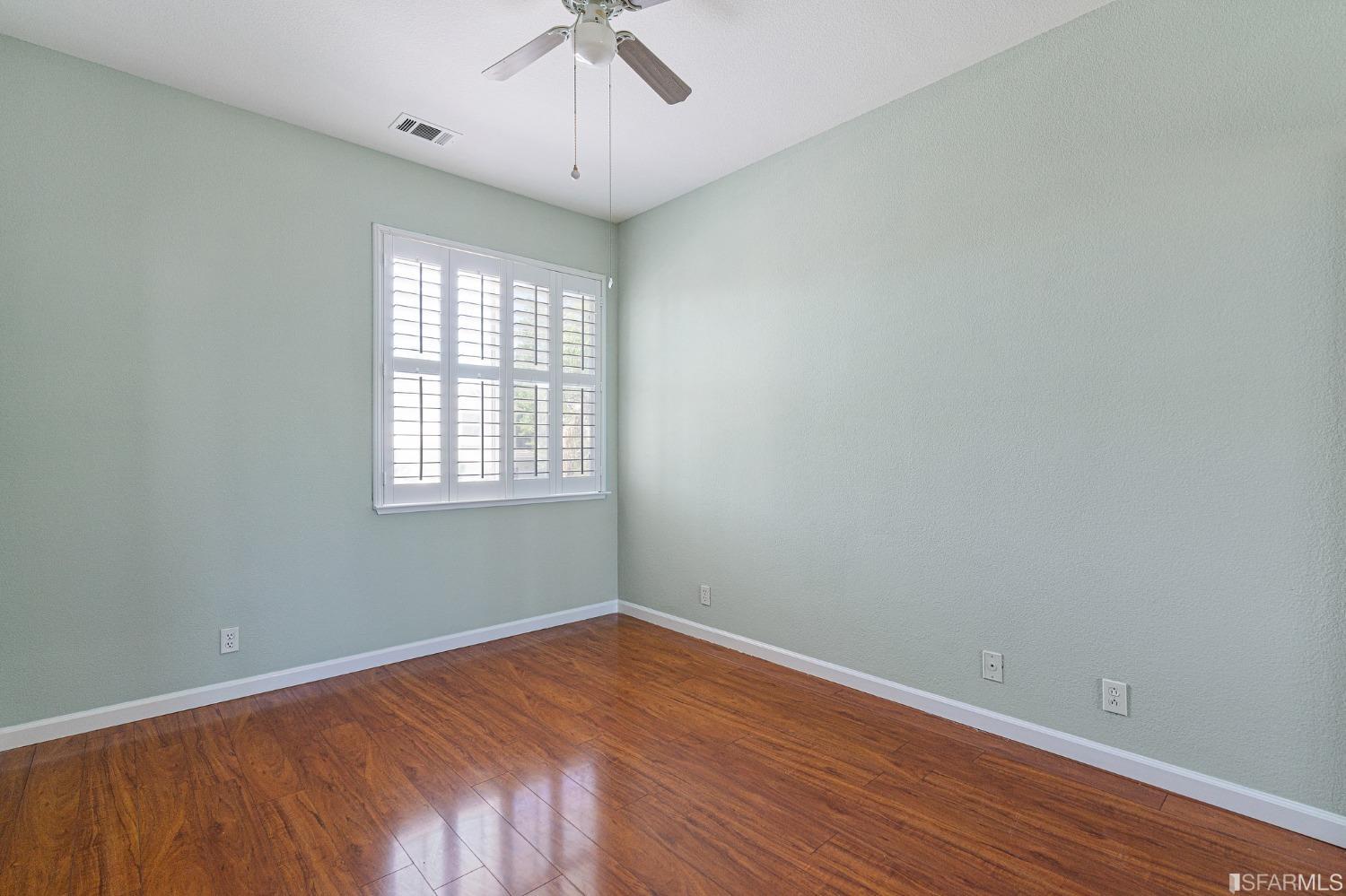 1359 Oak Crest Way Antioch, CA 94531 - Photo 51 of 65 wooden floor in an empty room with a window